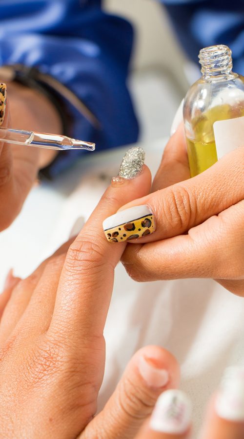 woman-fixing-her-nails-in-beauty-salon-manicurist-2023-03-28-19-47-03-utc